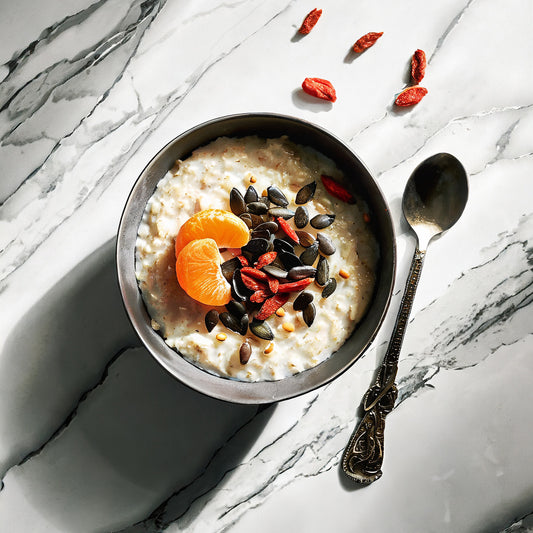 Sprouted Overnight Oats with Pumpkin Seeds, Chia Seed Protein, Mandarin Slices, Goji Berries, and Coconut Yogurt