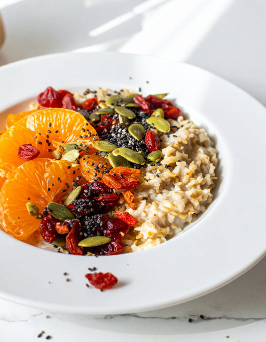 Sprouted Overnight Oats with Pumpkin Seeds, Chia Seed Protein, Mandarin Slices, Goji Berries, and Coconut Yogurt