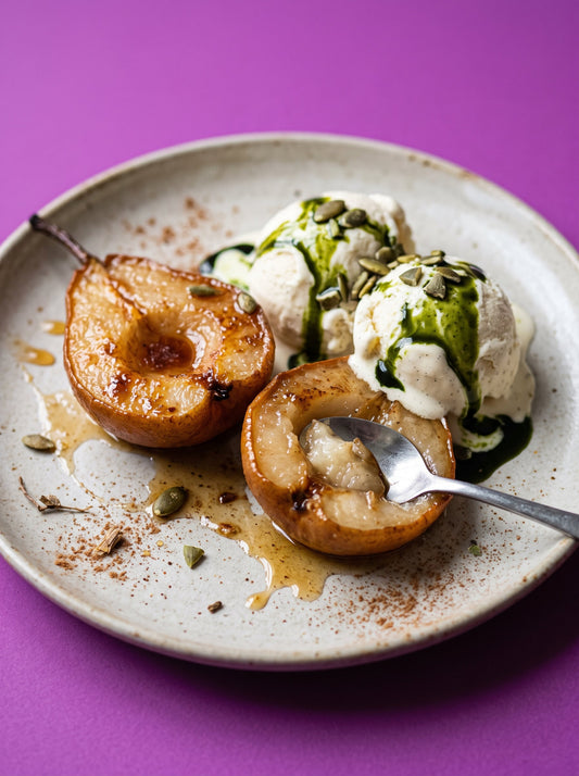 Roasted pears with vanilla ice cream and pumpkin seed oil